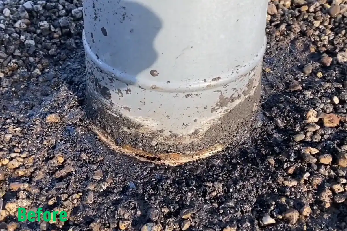 Flat roof pipe penetration with a damaged seal before puncture repair