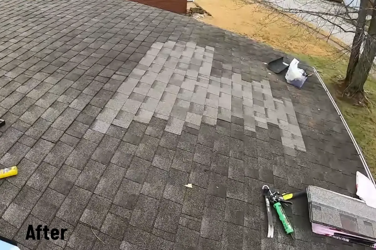 Asphalt shingle roof after the leak repair, with new shingles installed in the repaired area